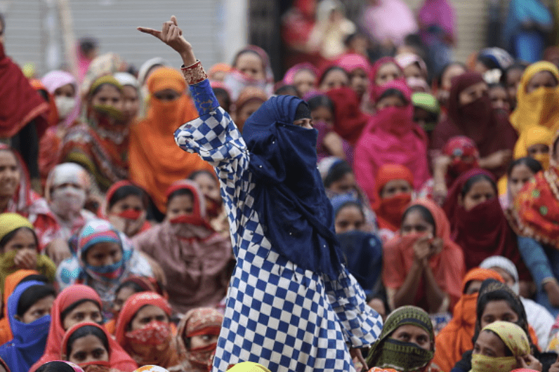Bangladeshi garment workers protest unfair wages in January. Photo credit: Getty Images