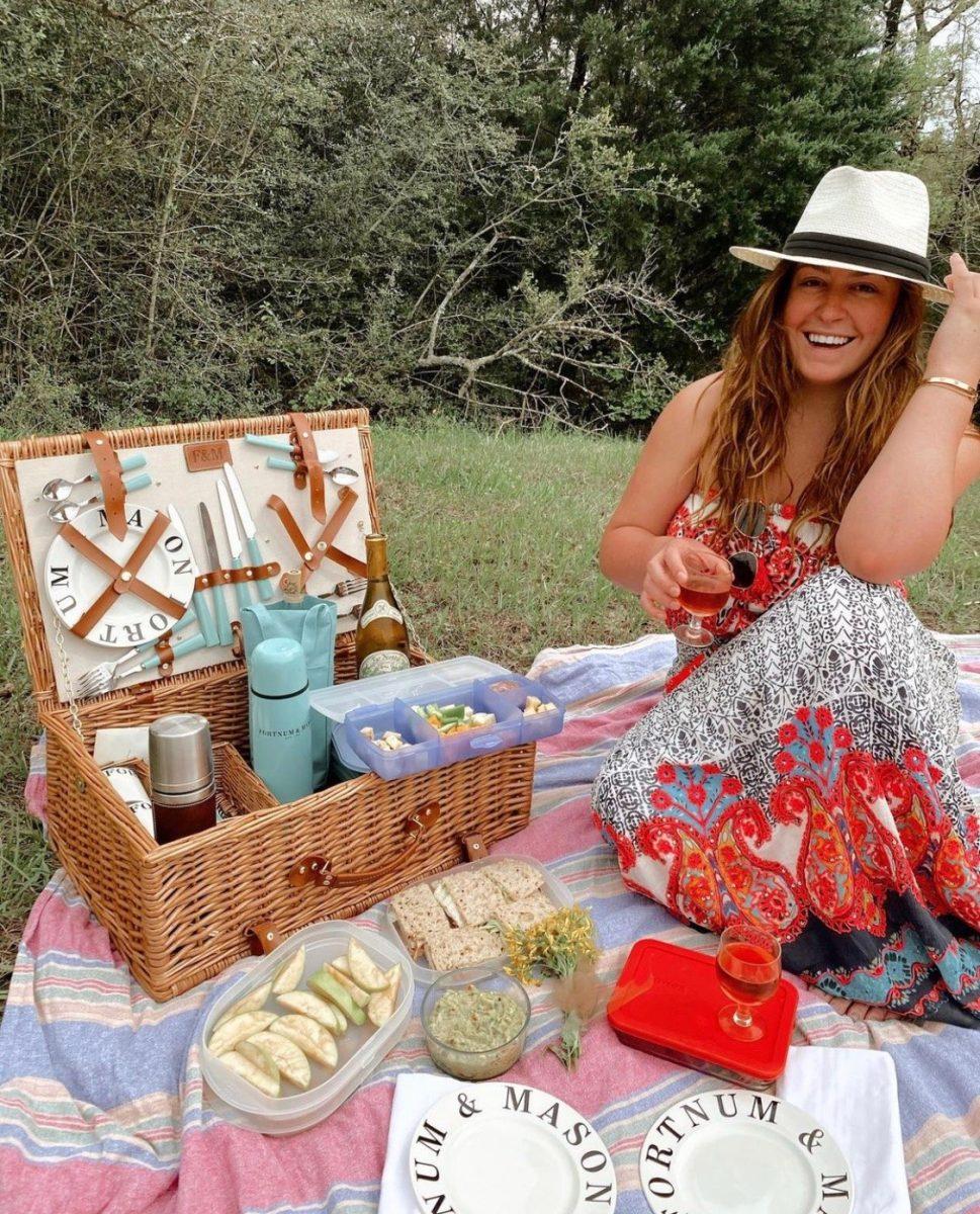 Taylor Rudell enjoys a picnic. Photo courtesy of Taylor Rudell via Instagram.