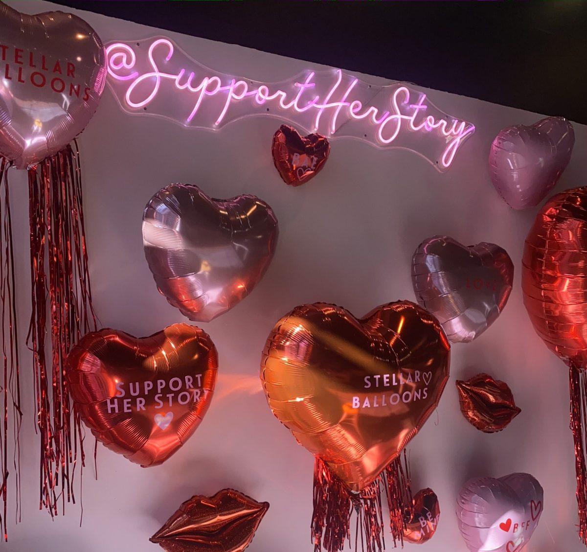 Balloon mural by Stellar Balloons as well as the neon sign showcasing the Support Her Story Instagram Photo credit: Ivy Nielsen